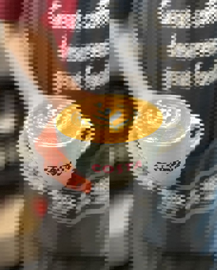 One Costa Barista Holding Flat White Square